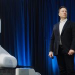 Elon Musk with Neuralink Equipment small
